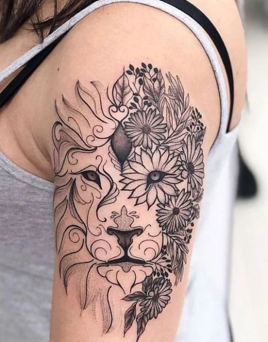 Tatouage Lion Réalisé Avec Des Fleurs Sur Le Bras 