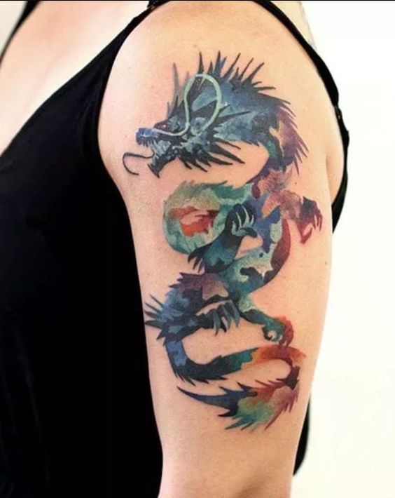 Tatouage Dragon Graphique Multicolore Sur Le Bras 