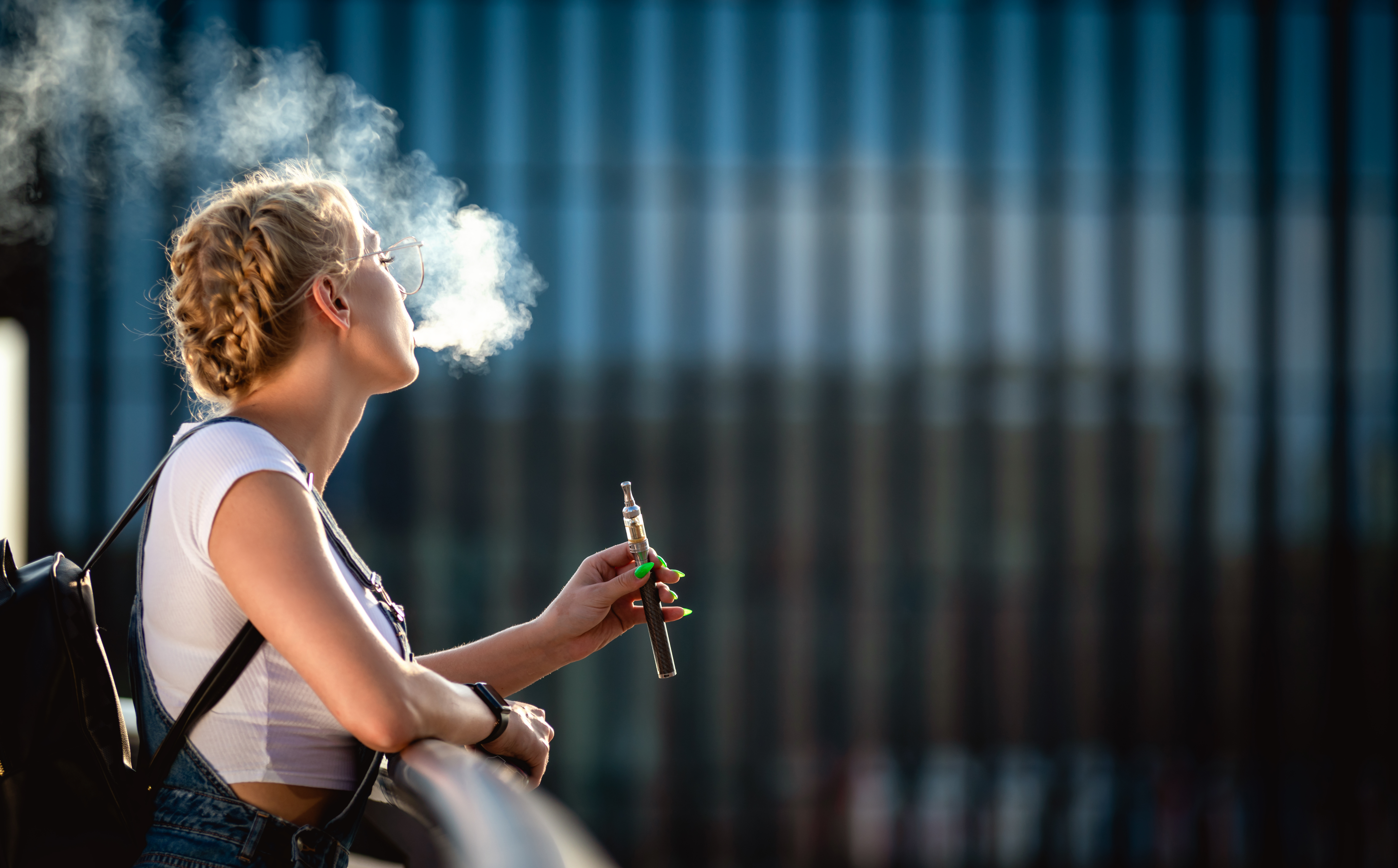 Young Woman Outdoor Vaping E Cigarette On Modern C 2024 10 30 22 50 52 Utc